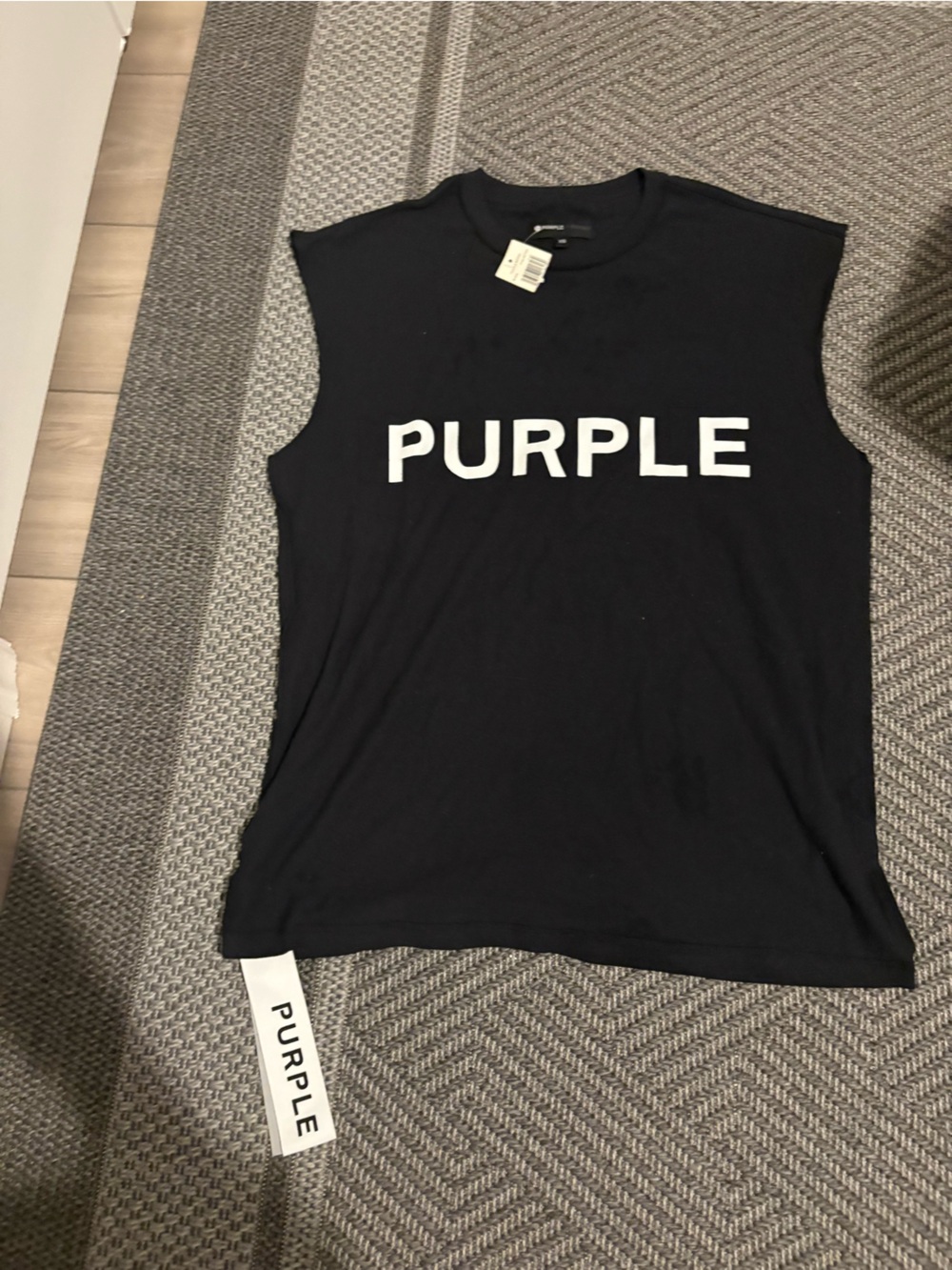 BLACK SLEEVESLESS PURPLE BRAND , WHITE “PURPLE” LOGO PRINT ON THE FRON